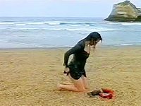 Sophie Marceau did an up skirt until she is totally naked! Her soaking wet clothes clung to her sexy body so she stripped her wet clothes showing off her big round boobs and unshaved pussy and laid down on the sand.